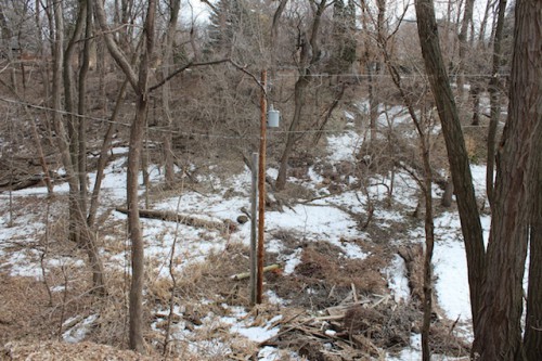 The power company pole at the bottom of the ravine.